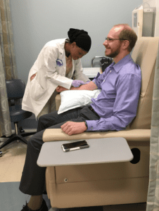 Dr. Denny submitting his sample to the All of Us Research Program 