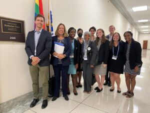 Kenny Westerman, PhD, (first on left) and Sofia Horan, MS, CGC, (fourth from right) outside Rep. Katherine Clark’s (D-MA 5th District) office. 