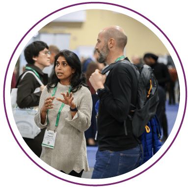 Exhibitor and Attendee discussing the latest technologies at on the Exhibit Floor